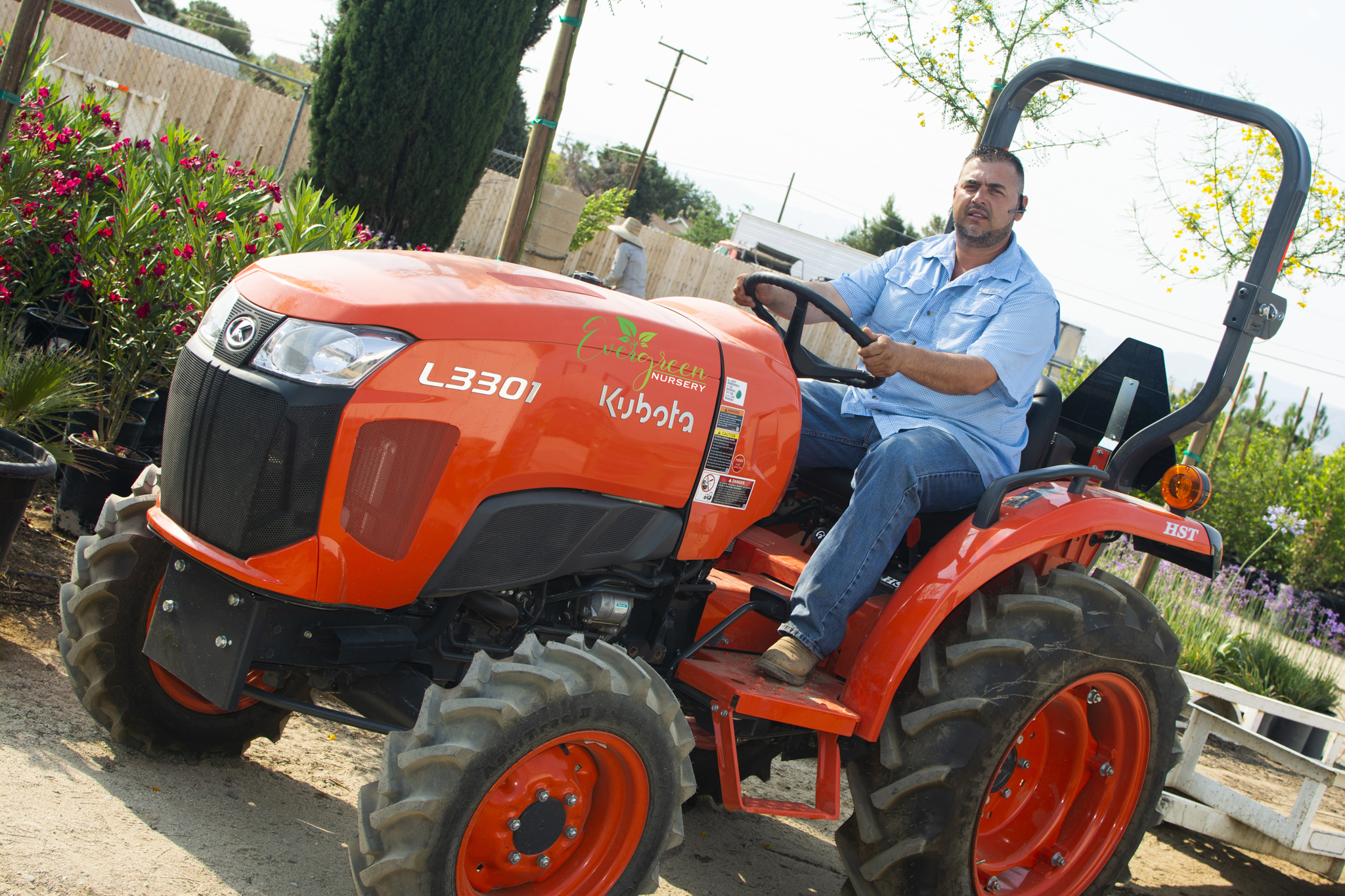 Evergreen Nursery team member on the Kubota tractor at the Palmdale nursery grounds
